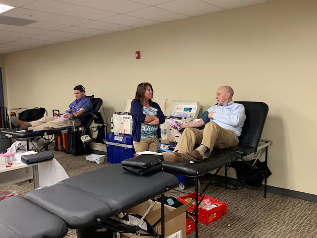 Photo of community participants giving blood during the drive.