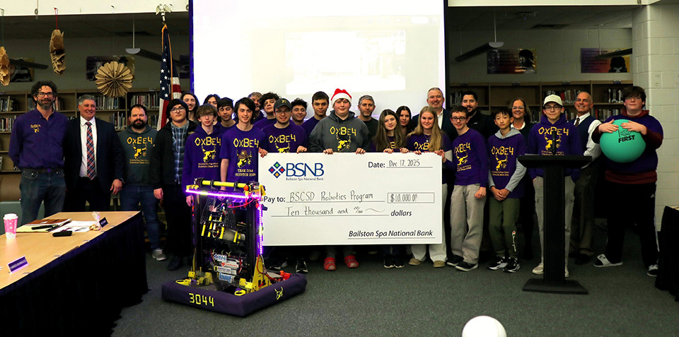 Group photo of check being presented to the Robotics Program