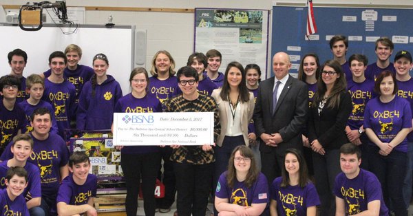 Group photo of check being presented to the Robotics Program
